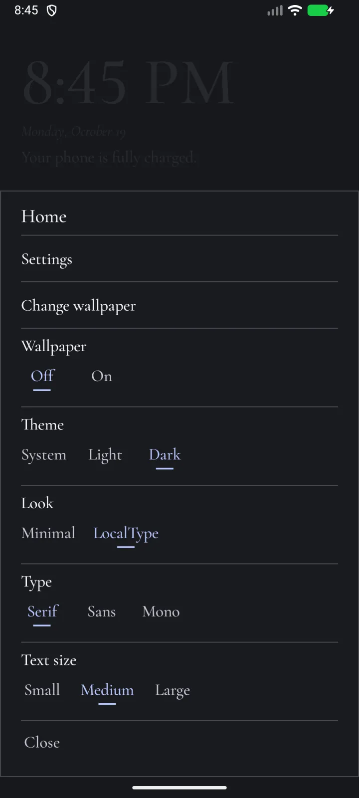The home menu over a dimmed home, in LocalType’s colors and the dark theme: Settings, Change wallpaper, then Wallpaper (Off, On), Theme (System, Light, Dark), Look (Minimal, LocalType), Type (Serif, Sans, Mono) and Text size (Small, Medium, Large), and Close.